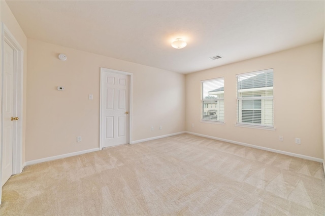 21514 Skyla Cir, Humble, TX 77338 - empty room featuring light colored carpet and baseboards
