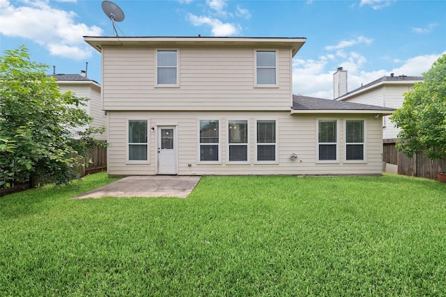 21514 Skyla Cir, Humble, TX 77338 - back of property with a patio area, a chimney, and roof with shingles