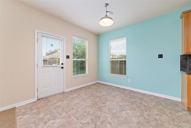 21514 Skyla Cir, Humble, TX 77338 - unfurnished dining area featuring healthy amount of natural light and baseboards