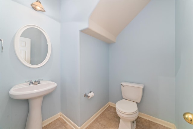 21514 Skyla Cir, Humble, TX 77338 - bathroom with toilet, tile patterned floors, and baseboards
