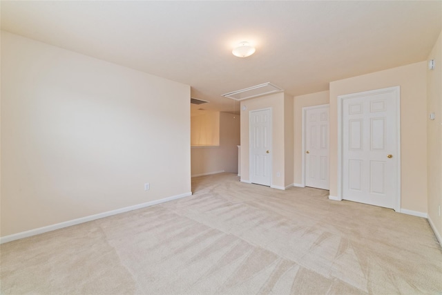 21514 Skyla Cir, Humble, TX 77338 - unfurnished bedroom featuring attic access, light carpet, and baseboards