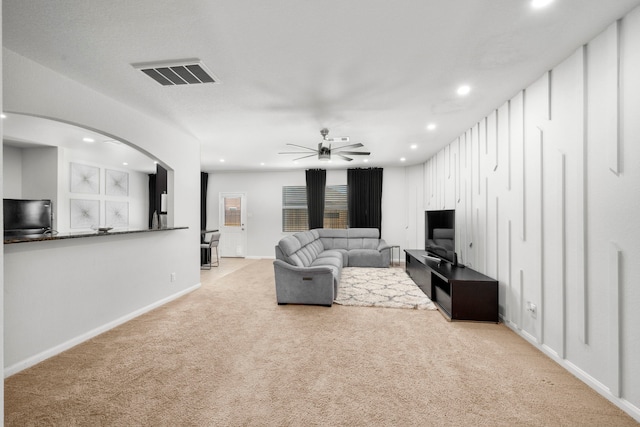6263 El Turquesa Dr, Houston, TX 77048 - carpeted living area with recessed lighting, a ceiling fan, baseboards, and arched walkways