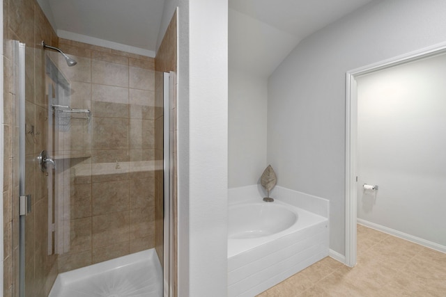 6263 El Turquesa Dr, Houston, TX 77048 - bathroom featuring a stall shower, a bath, tile patterned flooring, and lofted ceiling
