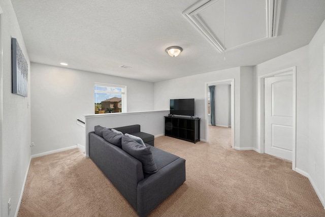 6263 El Turquesa Dr, Houston, TX 77048 - living area with attic access, light carpet, baseboards, and a textured ceiling
