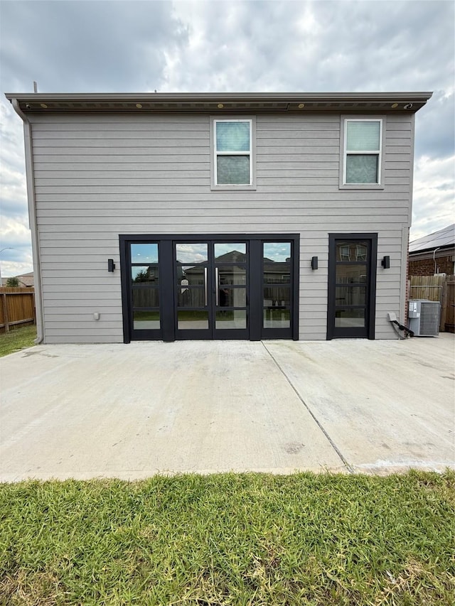6263 El Turquesa Dr, Houston, TX 77048 - back of house featuring a patio, central AC, fence, and french doors