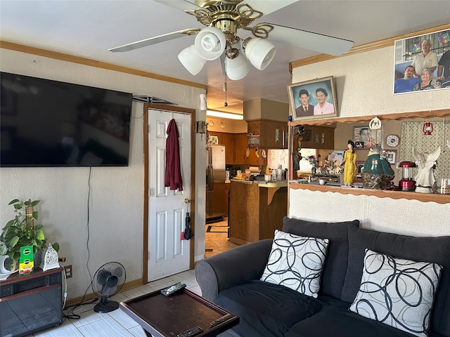 living area featuring ceiling fan and light tile patterned floors