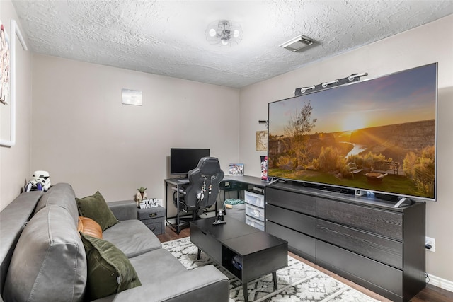18406 Bristol Bay Ct, Humble, TX 77346 - office featuring wood finished floors, a textured ceiling, and baseboards