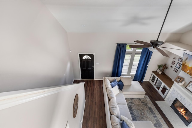 18406 Bristol Bay Ct, Humble, TX 77346 - living room featuring ceiling fan, wood finished floors, vaulted ceiling, and a glass covered fireplace