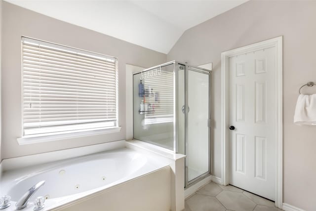 18406 Bristol Bay Ct, Humble, TX 77346 - bathroom with a jetted tub, a stall shower, tile patterned floors, and lofted ceiling