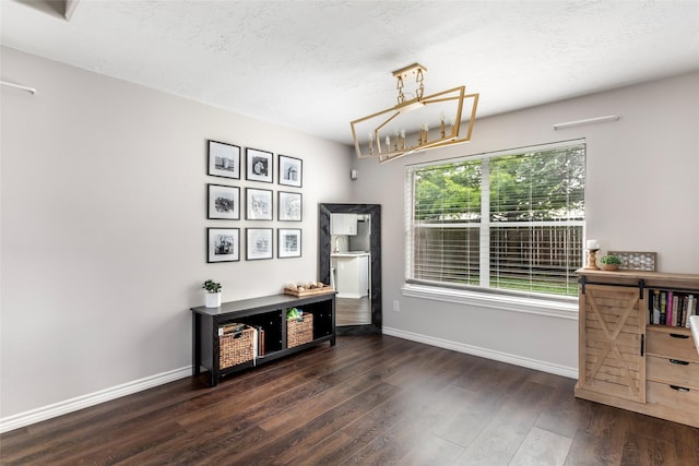 18406 Bristol Bay Ct, Humble, TX 77346 - dining area with dark wood-style floors, baseboards, a chandelier, and a textured ceiling