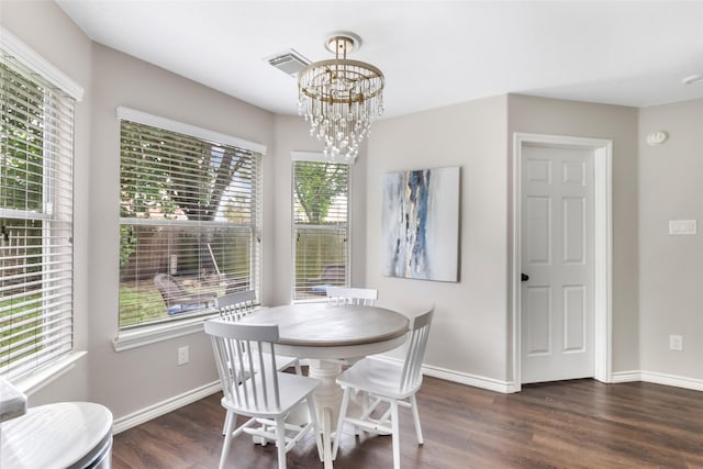 18406 Bristol Bay Ct, Humble, TX 77346 - dining room with a chandelier, dark wood-style flooring, and baseboards