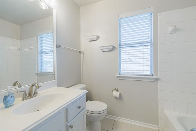 full bath with plenty of natural light, tile patterned floors, toilet, and vanity