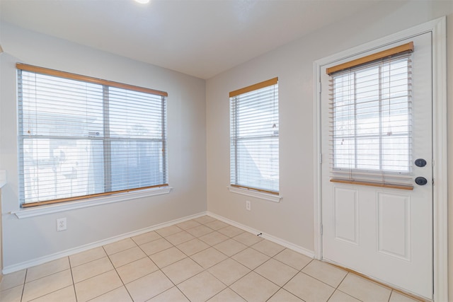 empty room featuring baseboards