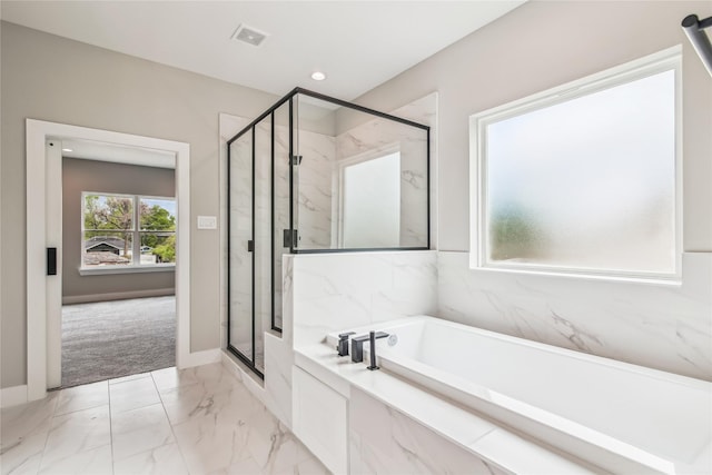 full bath featuring a garden tub, a marble finish shower, marble finish flooring, baseboards, and recessed lighting