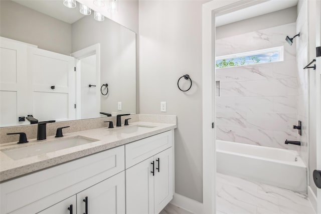 bathroom with baseboards, shower / bathtub combination, double vanity, and marble look tiles
