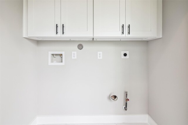 washroom with gas dryer hookup, hookup for an electric dryer, washer hookup, and cabinet space