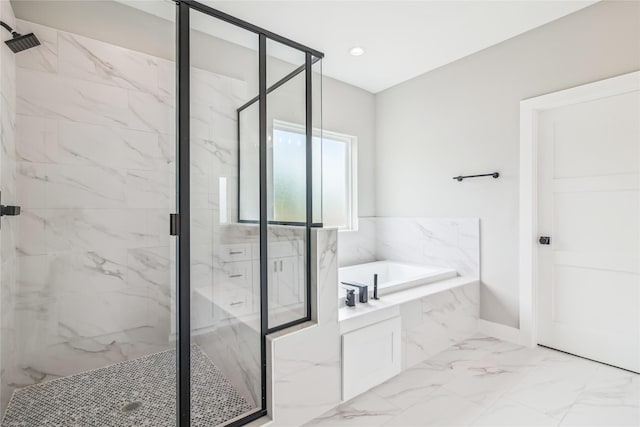 bathroom featuring a marble finish shower, a bath, marble finish floors, and baseboards