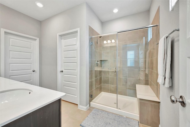 bathroom featuring tile patterned floors, a stall shower, vanity, and recessed lighting