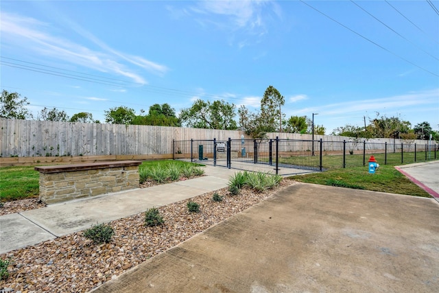 view of yard featuring a gate and fence