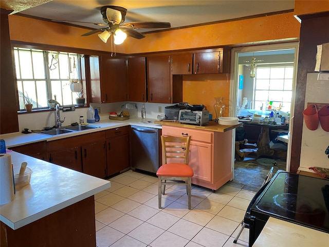 2138 Clifford St, Alvin, TX 77511 - kitchen with dishwasher, a sink, light countertops, and healthy amount of natural light
