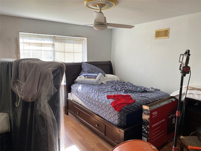 2138 Clifford St, Alvin, TX 77511 - bedroom featuring light wood finished floors and a ceiling fan