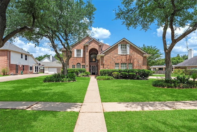 17406 Lonesome Dove Trl, Houston, TX 77095 - traditional-style house with brick siding, a front lawn, and a garage