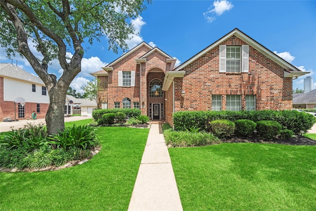 17406 Lonesome Dove Trl, Houston, TX 77095 - traditional-style home with brick siding and a front lawn