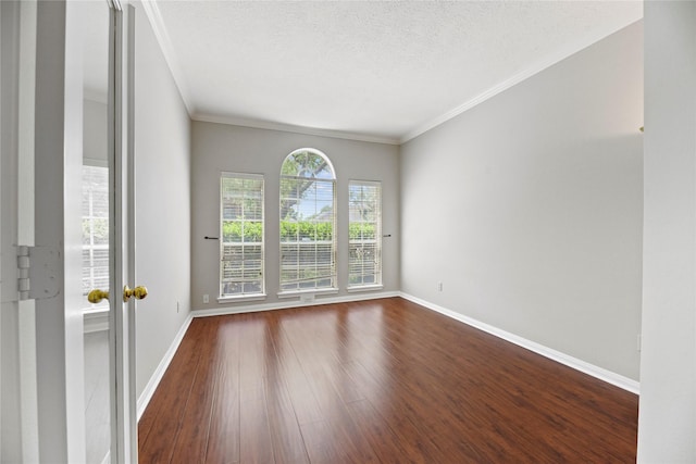 17406 Lonesome Dove Trl, Houston, TX 77095 - empty room featuring baseboards, dark wood-style floors, a textured ceiling, and ornamental molding