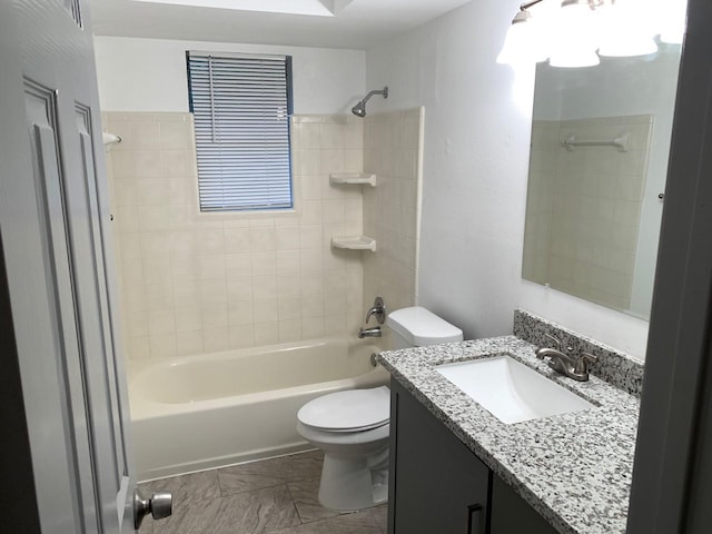 bathroom with toilet, shower / tub combination, and vanity