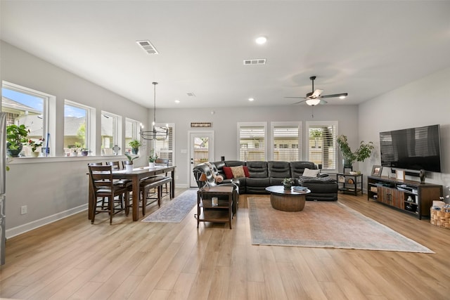 29622 Cedar Elm Way, Tomball, TX 77375 - living area featuring light wood-style flooring, ceiling fan, recessed lighting, a chandelier, and baseboards