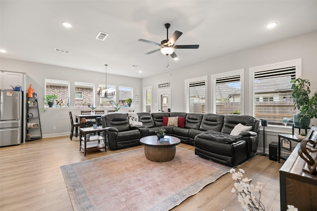 29622 Cedar Elm Way, Tomball, TX 77375 - living room with ceiling fan, light wood-style flooring, baseboards, recessed lighting, and a chandelier