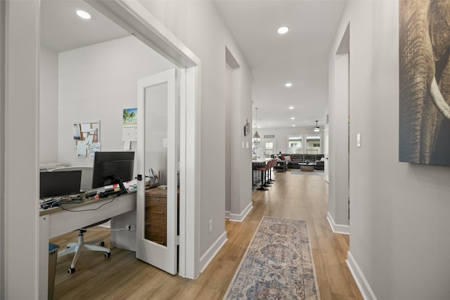 29622 Cedar Elm Way, Tomball, TX 77375 - corridor with light wood-style flooring, an office area, recessed lighting, and baseboards