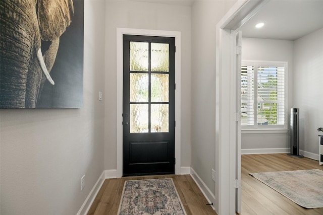 29622 Cedar Elm Way, Tomball, TX 77375 - doorway featuring wood finished floors, baseboards, and recessed lighting