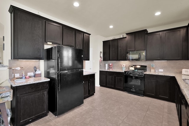 kitchen with black appliances, backsplash, light tile patterned flooring, light stone counters, and recessed lighting