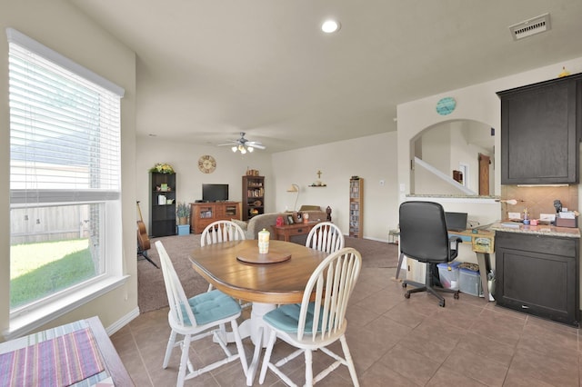 dining area with light tile patterned flooring, a ceiling fan, baseboards, and recessed lighting