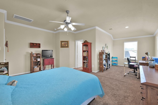 carpeted bedroom featuring an office area, baseboards, ornamental molding, and a ceiling fan