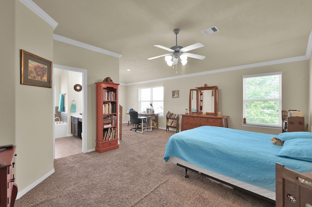 bedroom featuring light carpet, ornamental molding, connected bathroom, baseboards, and a ceiling fan