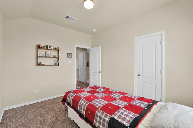 bedroom featuring carpet floors, lofted ceiling, and baseboards