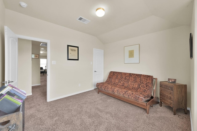 living area featuring carpet floors, vaulted ceiling, and baseboards