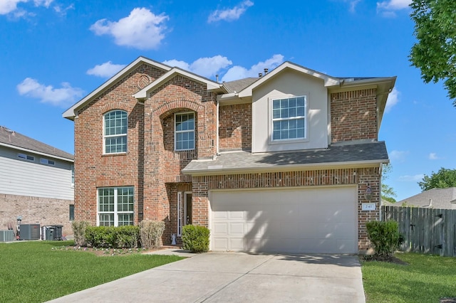 traditional home featuring brick siding, an attached garage, and driveway