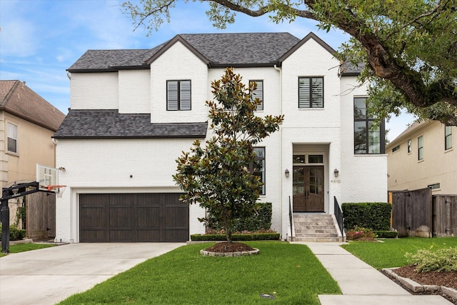 view of front facade featuring an attached garage, brick siding, concrete driveway, and a shingled roof