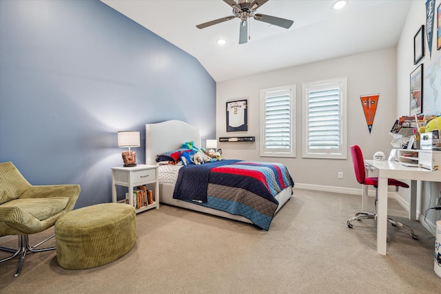 carpeted bedroom with lofted ceiling, baseboards, recessed lighting, ceiling fan, and a desk