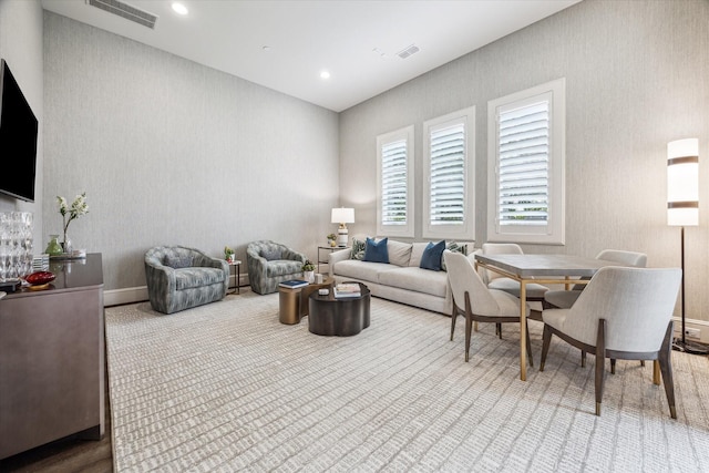 carpeted living room with baseboards