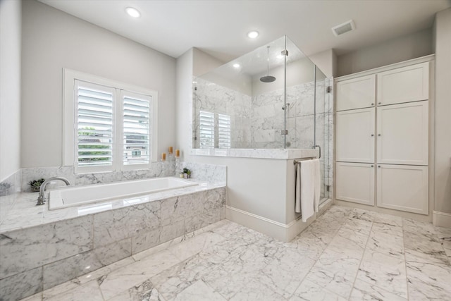 full bath with a bath, a marble finish shower, recessed lighting, and marble finish floors