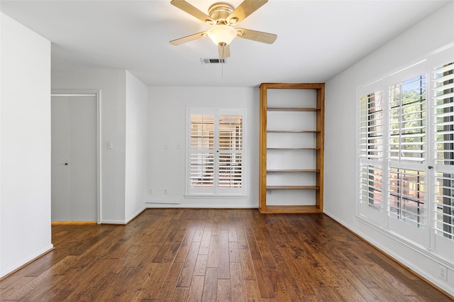 249 Hickory St, Huntsville, TX 77320 - unfurnished room featuring hardwood / wood-style floors, ceiling fan, and baseboards