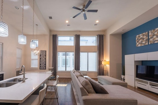 94 N Hutcheson St, Houston, TX 77003 - living area featuring dark wood finished floors, a ceiling fan, a towering ceiling, and recessed lighting