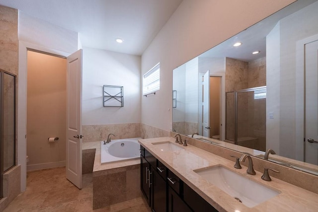 94 N Hutcheson St, Houston, TX 77003 - bathroom with toilet, a bath, a stall shower, double vanity, and baseboards
