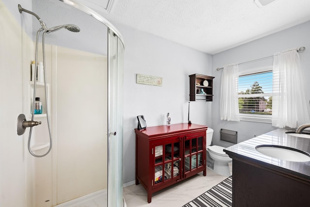 5024 County Road 476a, Freeport, TX 77541 - full bathroom featuring a stall shower, a textured ceiling, toilet, vanity, and marble finish floors