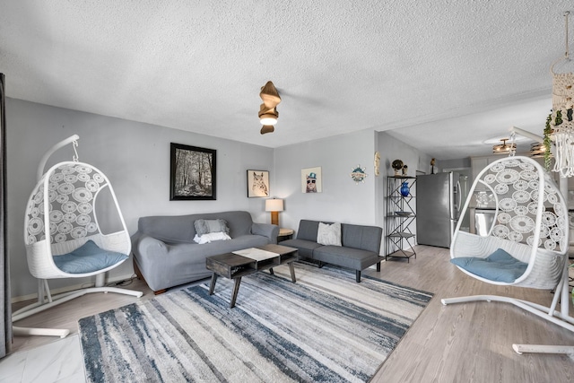 5024 County Road 476a, Freeport, TX 77541 - living room featuring a textured ceiling and wood finished floors