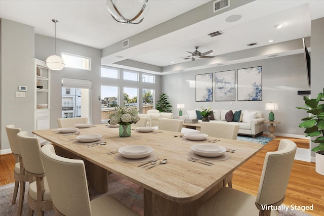 907 Rhode Pl Unit C, Houston, TX 77019 - dining space with baseboards, light wood-style floors, and a ceiling fan